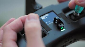 FPV drone pilot, close-up, hands holding the remote control. video