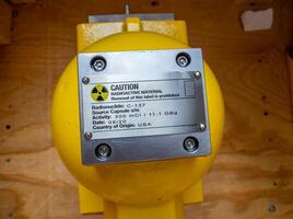 Radiation warning sign on the nameplate of mechanic holder of process instrument photo