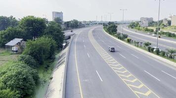 traffic is moving on road and a lot of tree showing healthy environment in Lahore on September 07, 2024. video