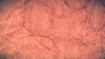 A close up of a red crumpled paper texture video
