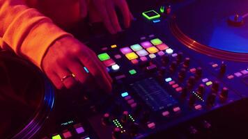 Electric vibe at nighttime DJ set in a vibrant club with colorful lights and pulsating beats video
