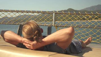 Young Happy Handsome Man Relaxing on Yacht While Sailing on Open Sea video