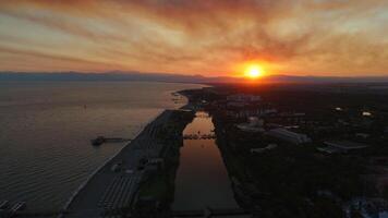 Sunset Drone View River Meets Sea, Sliding Bridge and Motorboat in Motion video