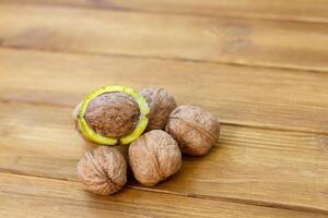 Walnuts on an old wooden table, close-up photo