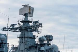 naval military background, concept, fragment of a modern warship with a navigation and radar equipment photo