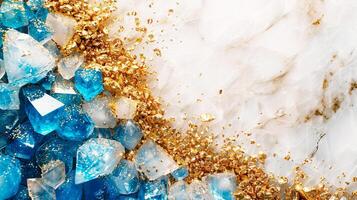 A vibrant macro shot of blue crystals and gold flakes on a marble background, creating a luxurious and dynamic contrast. photo
