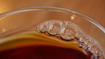 A Captivating CloseUp of Bubbles in a Dark, Rich Beverage That Invites Intrigue video