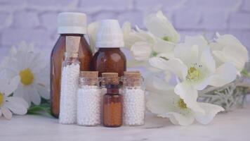 Homeopathic pills containers on a table video