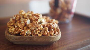 A Bowl Filled with Delicious Caramel Popcorn, Perfect for Sharing and Enjoying Together video