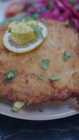 Savor Crispy Fried Fish with Lemon and a fresh Side Salad for a perfect meal experience video