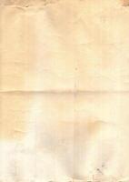 Interesting texture of old paper, soiled and damaged, as well as darkened by time and use, on a white background. Unique vintage texture of old paper which is approximately 60-70 years old. photo