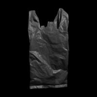 Black plastic bag isolated on white background photo