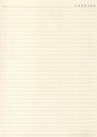 Yellow lined exercise paper with a ruled margin line running down it photo