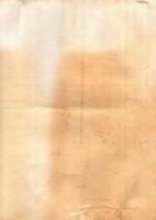 Interesting texture of old paper, soiled and damaged, as well as darkened by time and use, on a white background. Unique vintage texture of old paper which is approximately 60-70 years old. photo
