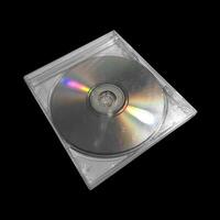 CD case on black background. Isolated transparent disk mockup. Clean cover box template. photo