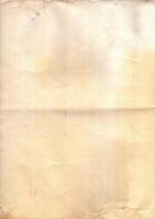 Interesting texture of old paper, soiled and damaged, as well as darkened by time and use, on a white background. Unique vintage texture of old paper which is approximately 60-70 years old. photo