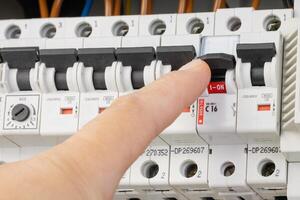 Testing circuits with probes in an electrical panel photo