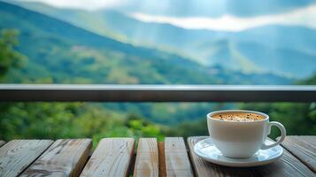 Coffee cup on a balcony with a blurred background of a scenic mountain view. photo