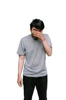 Southeast Asian man with tears in his eyes, expressing deep emotion and vulnerability. photo