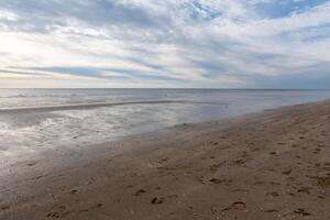 beach at the north sea in the evening in the cold fall photo