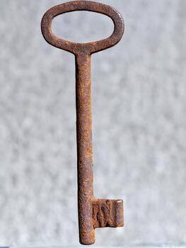 rusty key on wood photo