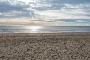 beach at the north sea in the evening in the cold fall photo