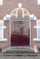 large door with decorations on old town house photo
