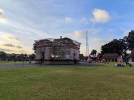 Blitar, Indonesia - September 09 2024 - Park in Alun Alun Kota Blitar, with green grass, and the sky in the afternoon. photo