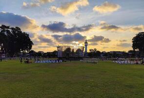 Blitar, Indonesia - September 09 2024 - Park in Alun Alun Kota Blitar, with green grass, and the sky in the afternoon. photo