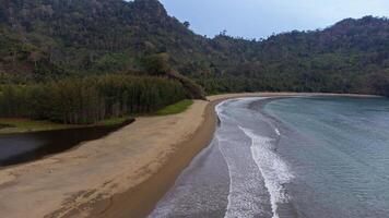 A very beautiful tropical beach with green trees. photo
