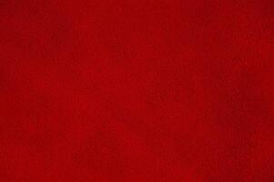 Red suede background macro photo. Suede texture. photo