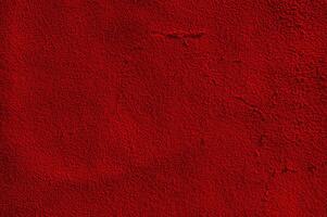 Red matte suede background macro photo. Suede texture photo