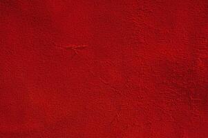 Red suede macro texture light and shadow. photo