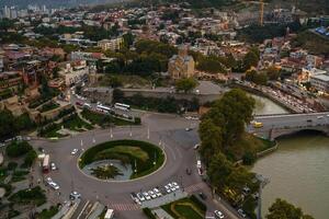Aerial view of Tbilisi showcasing vibrant city life, ancient architecture, and riverside tranquility photo