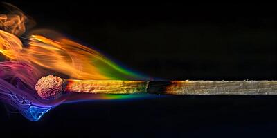 A burning match in different colors photo