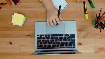 Female hands type on laptop keyboard touching touchpad. No face woman sits on sofa freelancing working at home writes post comments in social networks. High quality 4k footage video