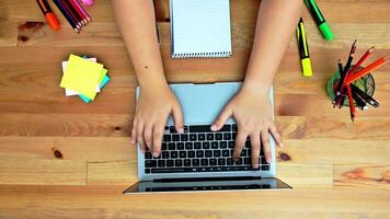 Female hands type on laptop keyboard touching touchpad. No face woman sits on sofa freelancing working at home writes post comments in social networks. High quality 4k footage video