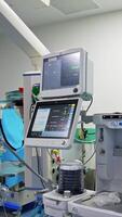 Empty operational table in the modern surgical theatre. Lots of advanced equipment in the operational room in up-to-date hospital. Vertical video
