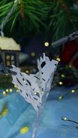 Modern robotic equipment for surgical operations unfold the paper clip. Christmas decorations with the help of innovative futuristic system. Close up. Vertical video