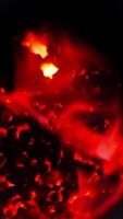 Charcoal burning with red fire in the furnace of the elevator factory. Heat from the fire which is used for heating the grain storage. High burning temperature charcoal close up. Vertical video