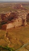 Amazing rock formations from air erosion in huge desert. Arches National park in Utah, USA from aerial perspective on sunny day. Vertical video