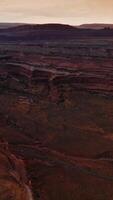 Tremendous rocks and deserts in National Park of Zion. Amazing mountains of Utah at setting sun. Aerial view. Vertical video