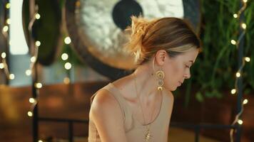 The girl begins to prepare for meditation video