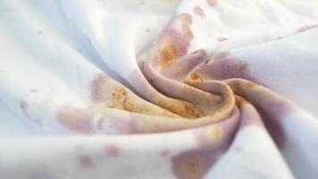 An Elegant Swirl of Soft White Fabric Enhanced by Subtle and Intriguing Color Stains video