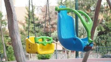 Vibrant and Colorful Toddler Swings Are Offered in a Delightful and Inviting Playground Setting video