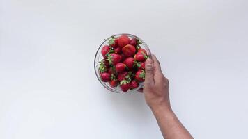 Fresh Strawberries Arranged Elegantly in a Glass Bowl on a Crisp White Background video