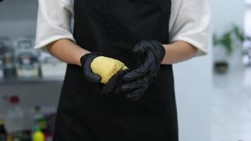 black fart and latex chef gloves knead thick dough with your hands Kneading Pizza Dough by Hand on a White Table Top video