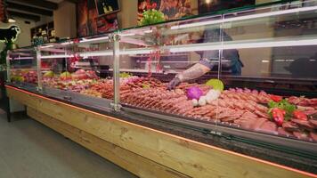 Selection of different cuts of fresh meat raw red in a supermarket. video