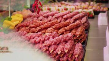 Turkish kebab on skewers layout in a shop. video