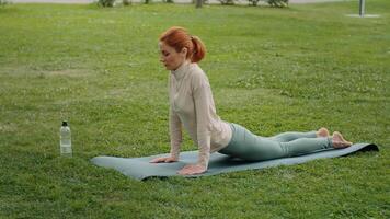 Caucasian lady stretching outdoors connecting with nature. video